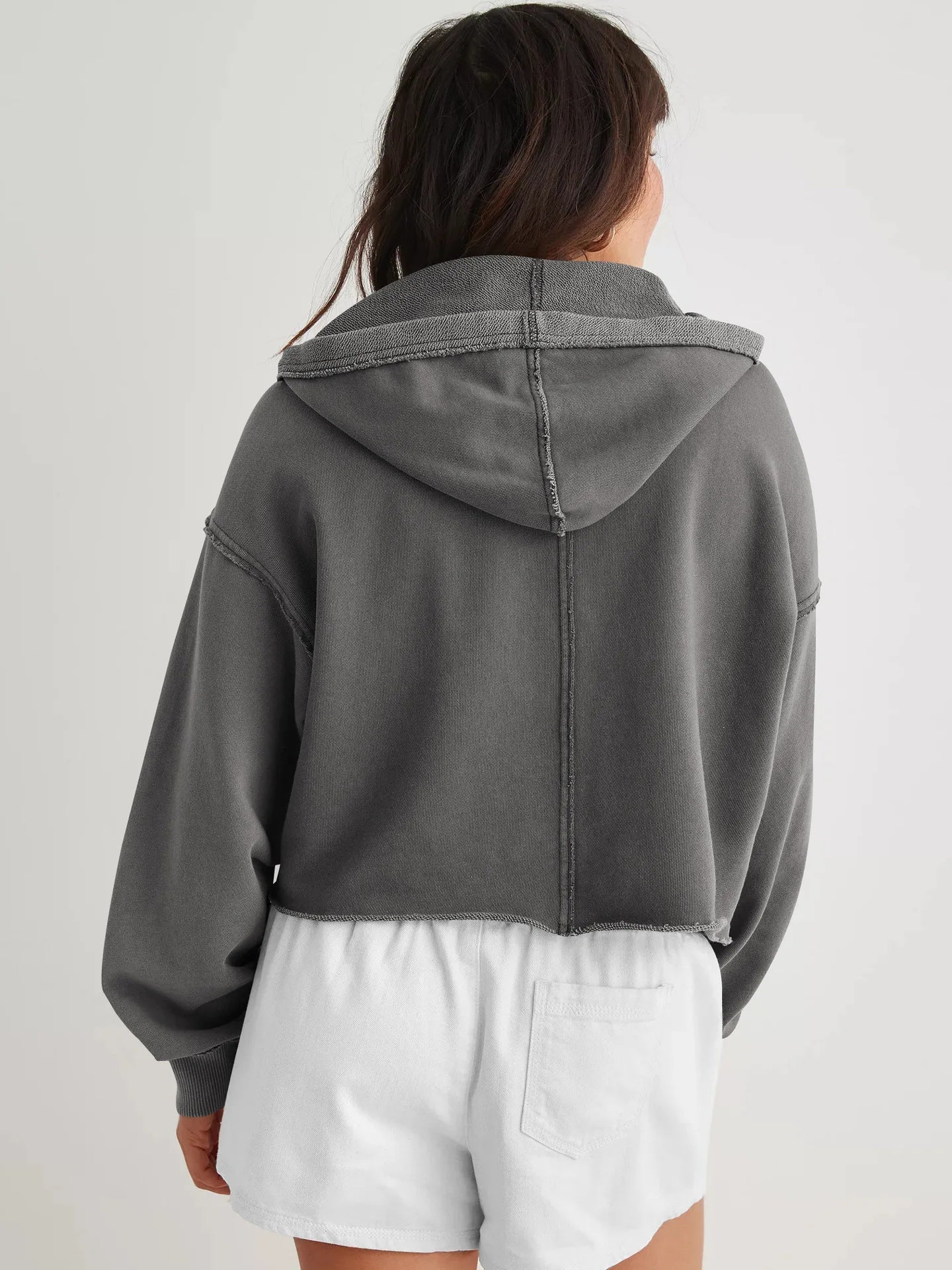 Christine Brewer Eleanor women's cropped hoodie displayed on a model, featuring a casual, stylish fit with a drawstring hood.