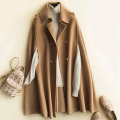 Elegant ivory cape coat for women by Christine Brewer, featuring a flowing design and stylish collar detail.