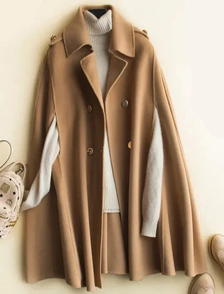 Elegant ivory cape coat for women by Christine Brewer, featuring a flowing design and stylish collar detail.