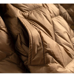 Women’s Aurora short quilted puffer jacket by Christine Brewer, featuring a stylish quilted design and cozy insulation.