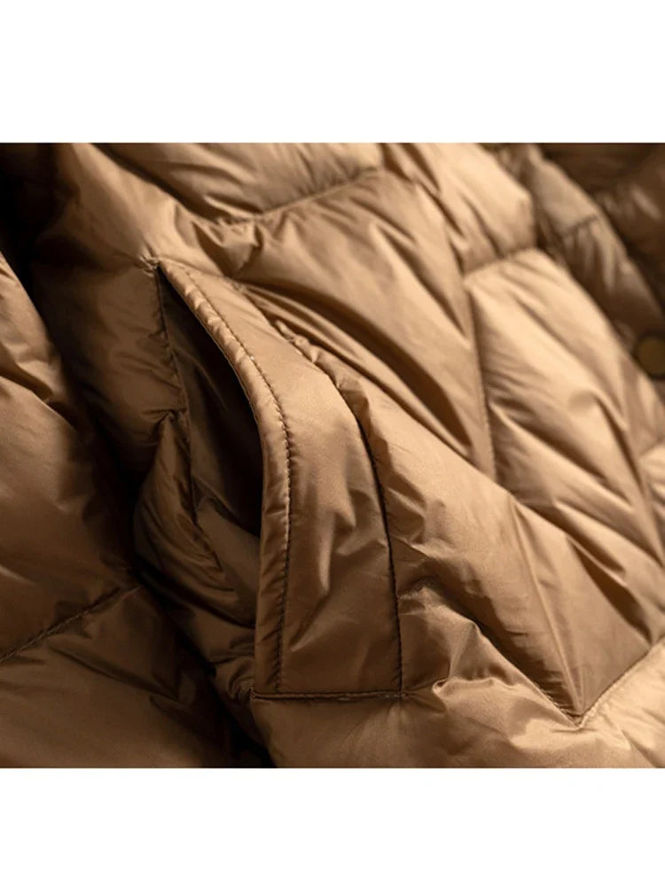 Women’s Aurora short quilted puffer jacket by Christine Brewer, featuring a stylish quilted design and cozy insulation.