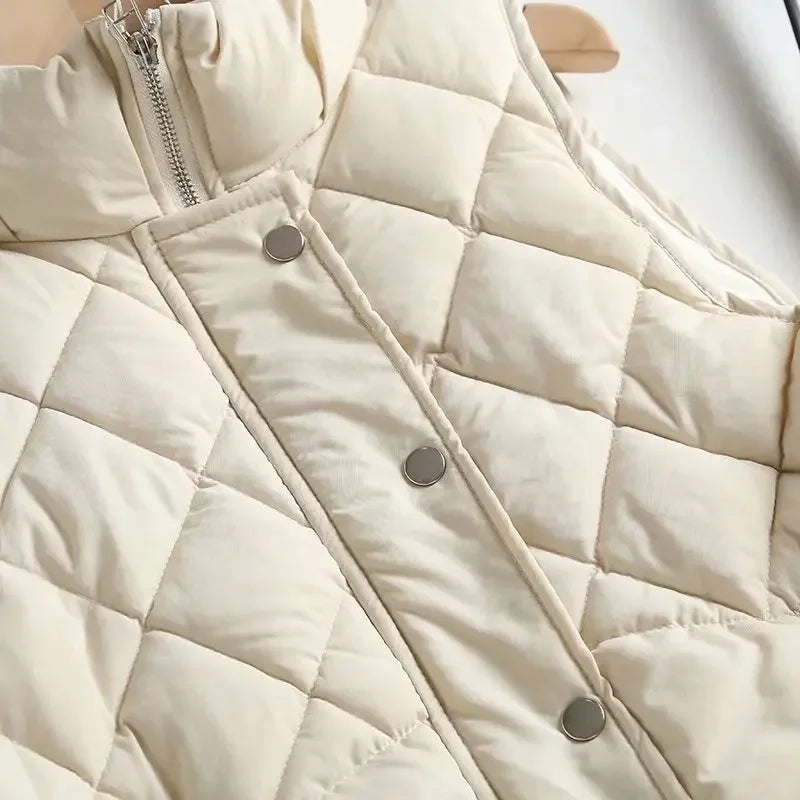 Ruby stand collar puffer vest for women by Christine Brewer, featuring a quilted design and insulated warmth.