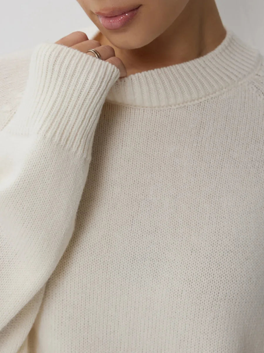 Oversized women's wool sweater from Flora by Christine Brewer, featuring a cozy, chunky knit in neutral tones.