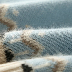Cream-colored Christine Brewer Jolene cashmere mock neck sweater for women, displayed on a hanger with a cozy, soft texture.