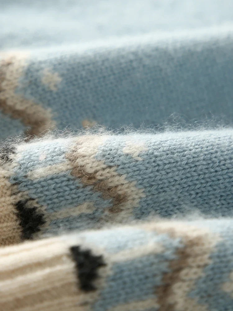 Cream-colored Christine Brewer Jolene cashmere mock neck sweater for women, displayed on a hanger with a cozy, soft texture.