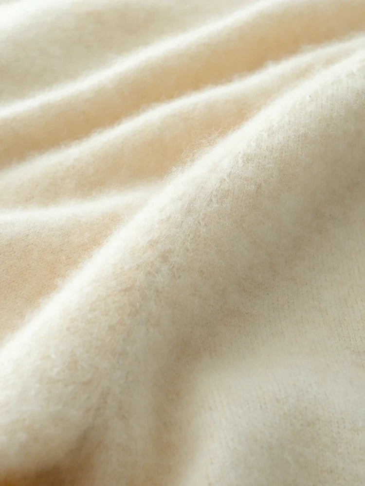 Helen cashmere sweater for women by Christine Brewer, soft beige knit with a relaxed fit and ribbed cuffs.