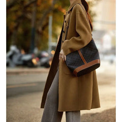 Green long wool coat for women by Christine Brewer, featuring a stylish and cozy design with a tailored fit.