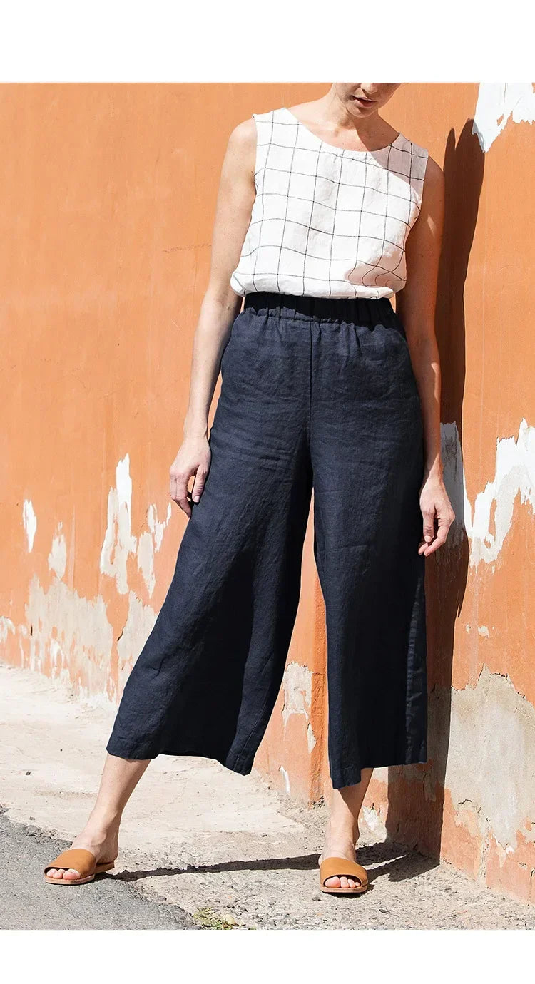 Women’s linen cropped wide-leg trousers with drawstring waist, loose pull-on style by Christine Brewer, shown in a relaxed fit with natural fabric.