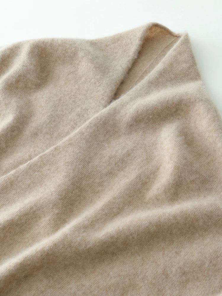 Helen cashmere sweater for women by Christine Brewer, soft beige knit with a relaxed fit, displayed on a hanger.