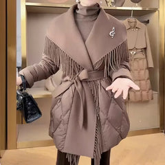 Women’s belted quilted puffer jacket by Christine Brewer, Stella collection, with a hood and padded design for warmth and style.