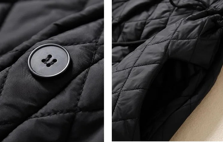 Women’s longline puffer jacket by Christine Brewer, featuring a stylish, insulated design with a high collar and quilted pattern.