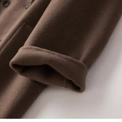 Brown double-breasted wool coat for women by Christine Brewer, featuring classic design and tailored fit.