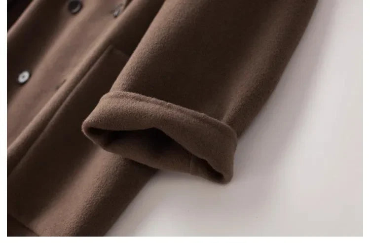 Brown double-breasted wool coat for women by Christine Brewer, featuring classic design and tailored fit.