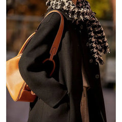 Green long wool coat for women by Christine Brewer, featuring a stylish, tailored design perfect for cold weather.