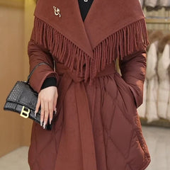 Women’s belted quilted puffer jacket by Christine Brewer featuring a stylish quilted design and a waist belt for a chic look.