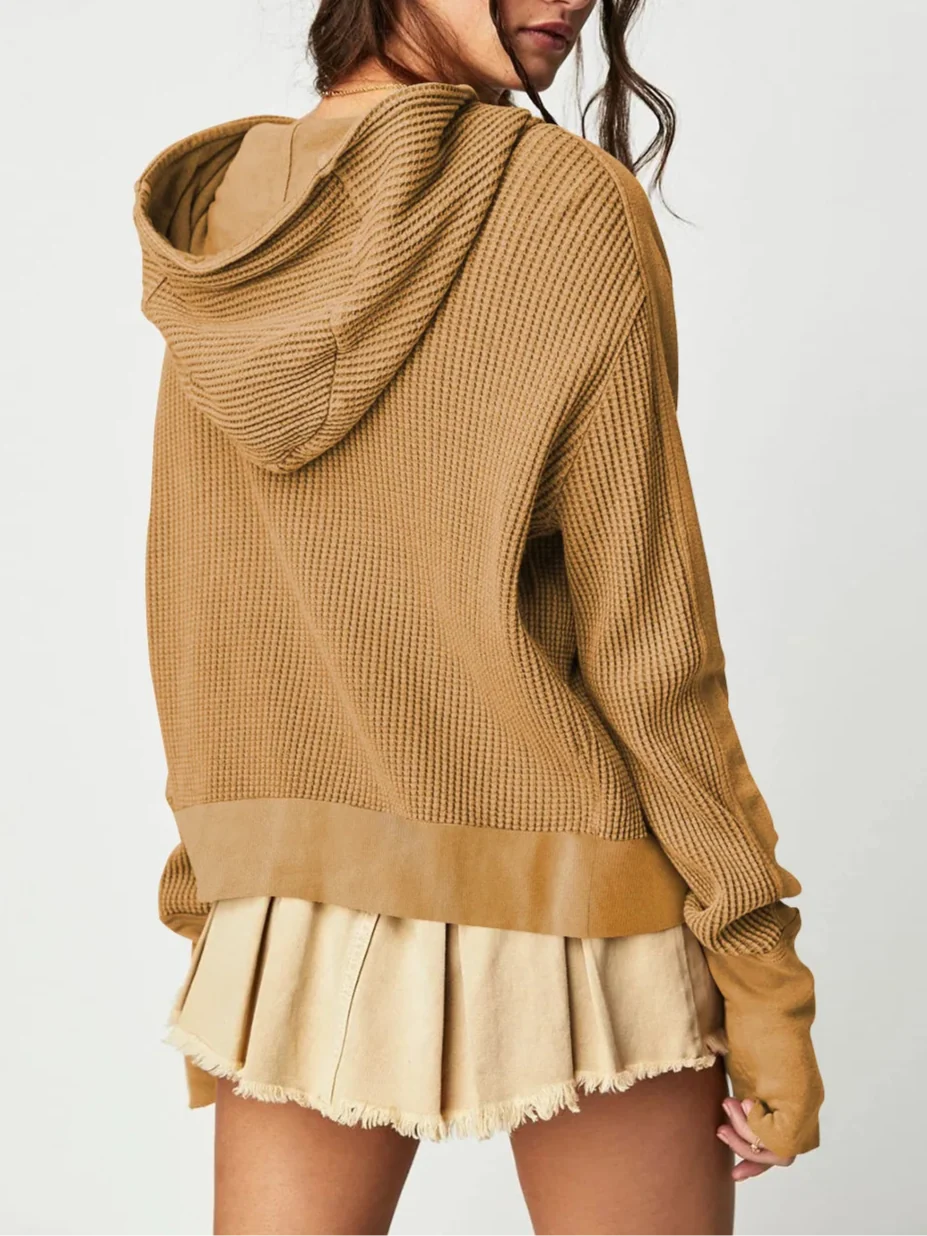 Mia cropped hooded hoodie for women by Christine Brewer, shown in a relaxed fit with front pocket and drawstring hood.