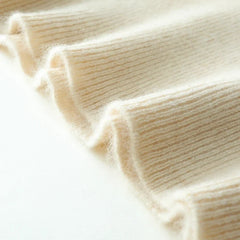 Helen cashmere sweater for women by Christine Brewer, soft beige knit with a relaxed fit and ribbed cuffs.
