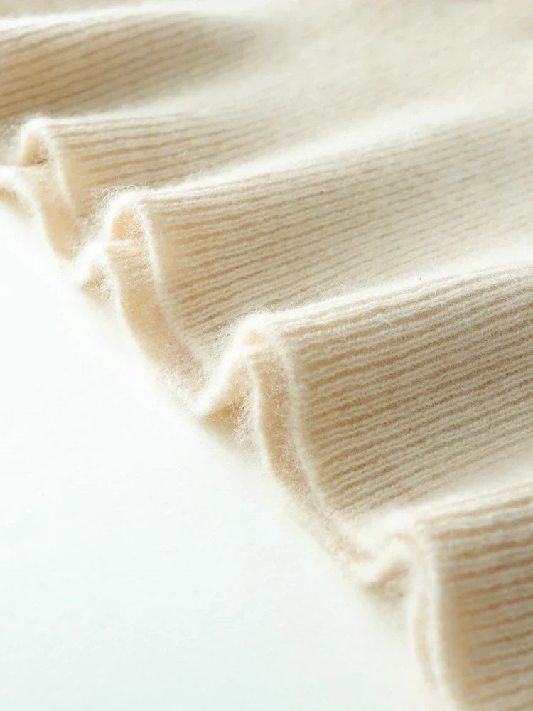 Helen cashmere sweater for women by Christine Brewer, soft beige knit with a relaxed fit and ribbed cuffs.