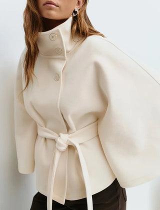 Emma belted cape coat for women by Christine Brewer, shown in a stylish, elegant design with a belt and flowing fabric.