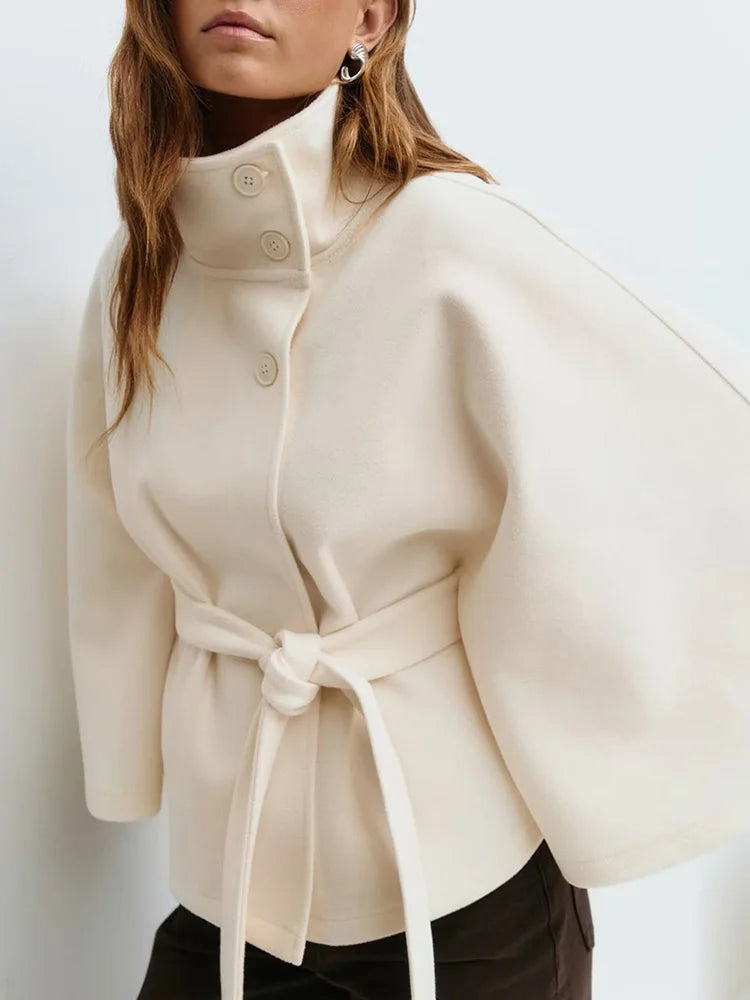 Emma belted cape coat for women by Christine Brewer, shown in a stylish, elegant design with a belt and flowing fabric.