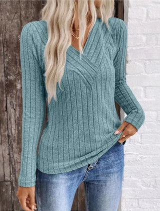 Kaitlyn striped women's sweater by Christine Brewer, featuring a cozy knit design with colorful horizontal stripes.