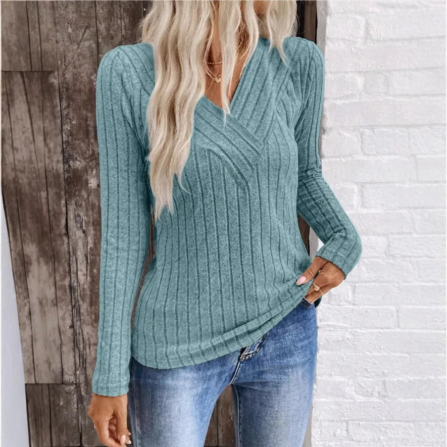 Kaitlyn striped women's sweater by Christine Brewer, featuring a cozy knit design with colorful horizontal stripes.