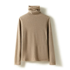Cream-colored Gabrielle cashmere turtleneck sweater for women by Christine Brewer, displayed on a mannequin with a cozy, stylish fit.