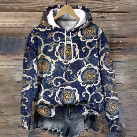 Lightweight oversized soft knit hoodie from Christine Brewer's Adeline collection, featuring a cozy design in neutral tones.