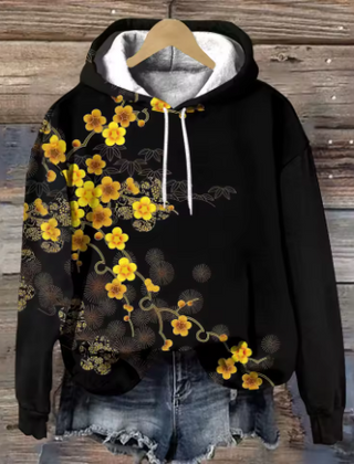 Maisie cozy oversized soft knit hoodie by Christine Brewer, shown in a warm, relaxed fit with a front pocket and hood.