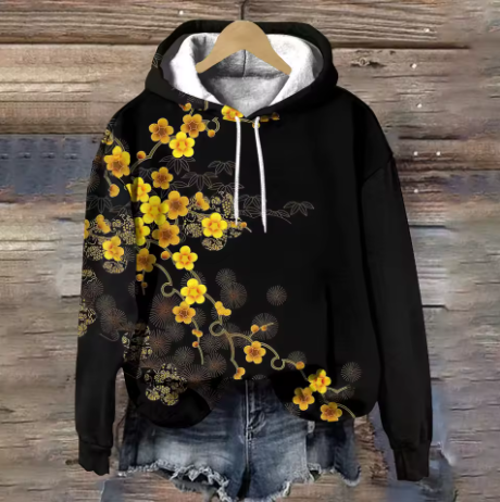 Maisie cozy oversized soft knit hoodie by Christine Brewer, shown in a warm, relaxed fit with a front pocket and hood.