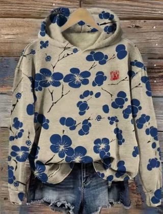 Soft knit hoodie by Christine Brewer, oversized and cozy with a lightweight design, shown in a relaxed fit with a hood and long sleeves.