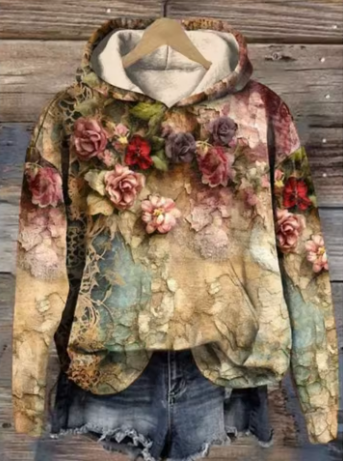 Lightweight oversized knit hoodie from Christine Brewer featuring a cozy Daisy design in soft, comfortable fabric.