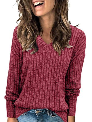 Oversized V-neck sweater for women by Christine Brewer, featuring a cozy fit and soft knit fabric in a neutral color.
