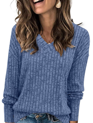 Oversized V-neck sweater for women by Christine Brewer, featuring a cozy fit and soft knit fabric in a neutral color.