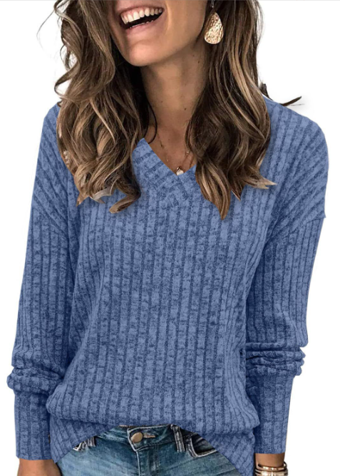 Oversized V-neck sweater for women by Christine Brewer, featuring a cozy fit and soft knit fabric in a neutral color.