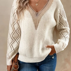 Beige V-neck sweater for women by Christine Brewer, featuring a cozy knit design and long sleeves.
