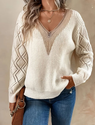 Beige V-neck sweater for women by Christine Brewer, featuring a cozy knit design and long sleeves.