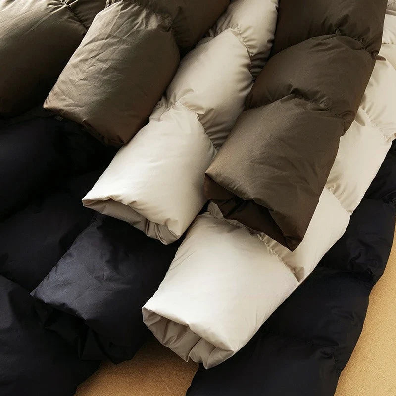 Long hooded women's parka from Christine Brewer's Ava collection, shown in a stylish, weather-resistant design with a cozy hood.