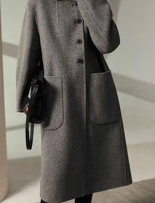 Green wool coat for women, long Lucy coat by Christine Brewer, featuring a tailored fit and classic design.
