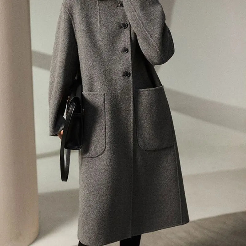 Green wool coat for women, long Lucy coat by Christine Brewer, featuring a tailored fit and classic design.