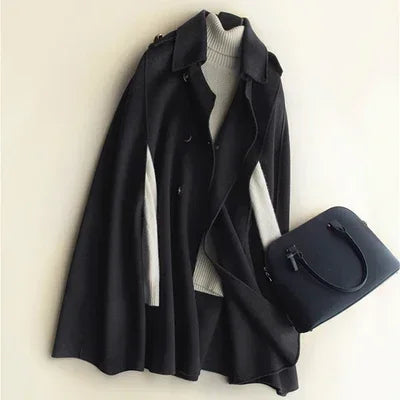 Elegant ivy-green cape coat for women by Christine Brewer, featuring a flowing design and sophisticated style.
