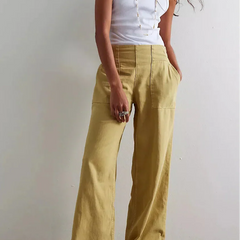 Blue denim wide-leg women's jeans by Christine Brewer, relaxed fit pants with a stylish, casual look.