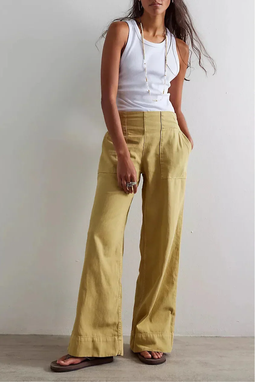 Blue denim wide-leg women's jeans by Christine Brewer, relaxed fit pants with a stylish, casual look.