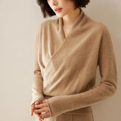 Woman wearing a beige Christine Brewer Dawn cashmere sweater, showcasing its soft, luxurious knit and relaxed fit.