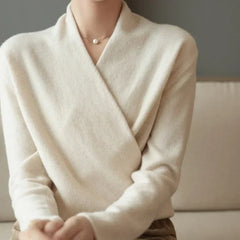 Cream-colored Gwen cashmere V-neck sweater for women by Christine Brewer, shown laid flat with soft fabric details.