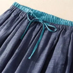 Women’s tapered linen trousers by Christine Brewer, loose pull-on pants with a relaxed fit and lightweight, breathable fabric.