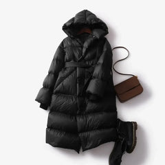 Ella long belted puffer jacket for women by Christine Brewer, featuring a stylish quilted design and adjustable belt.