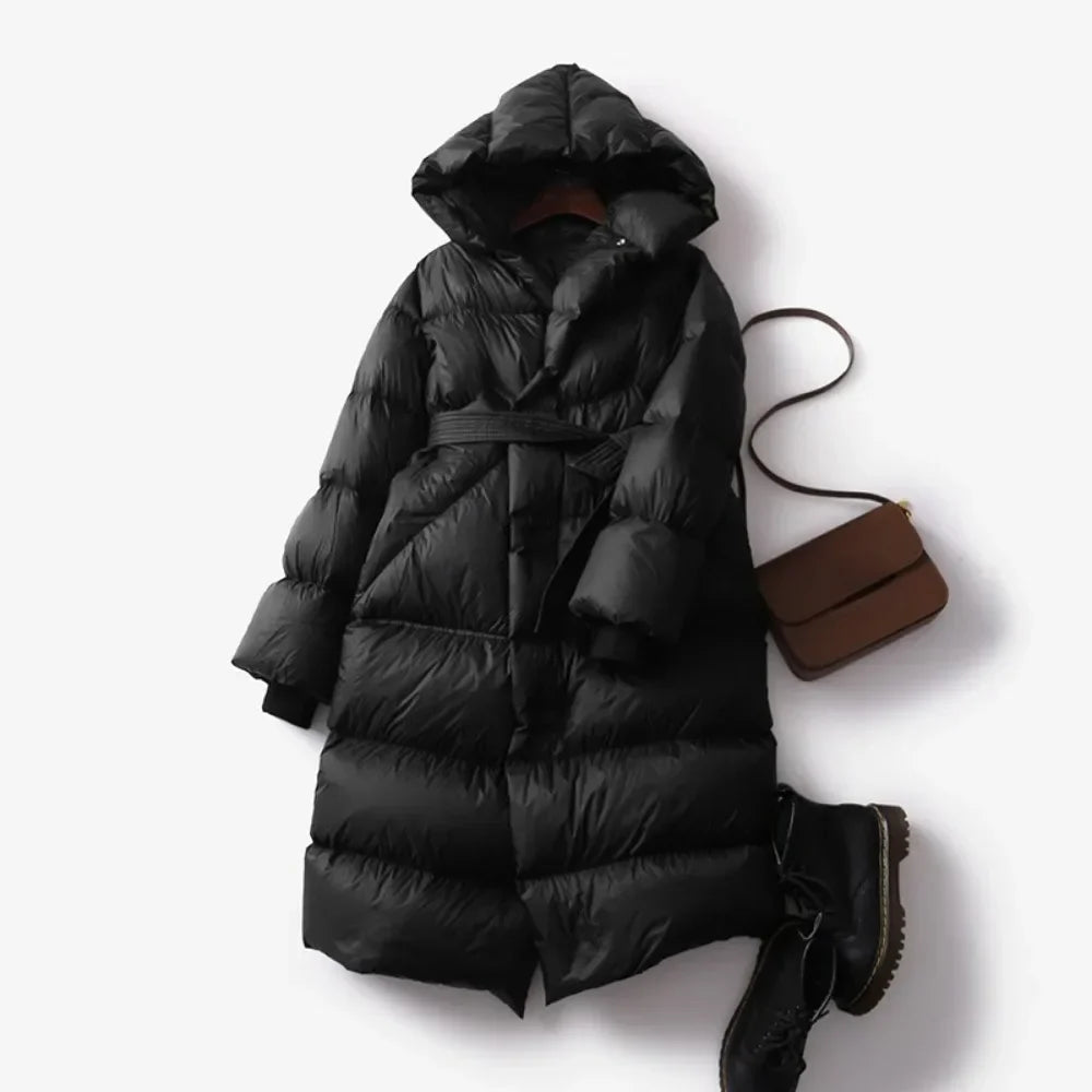 Ella long belted puffer jacket for women by Christine Brewer, featuring a stylish quilted design and adjustable belt.
