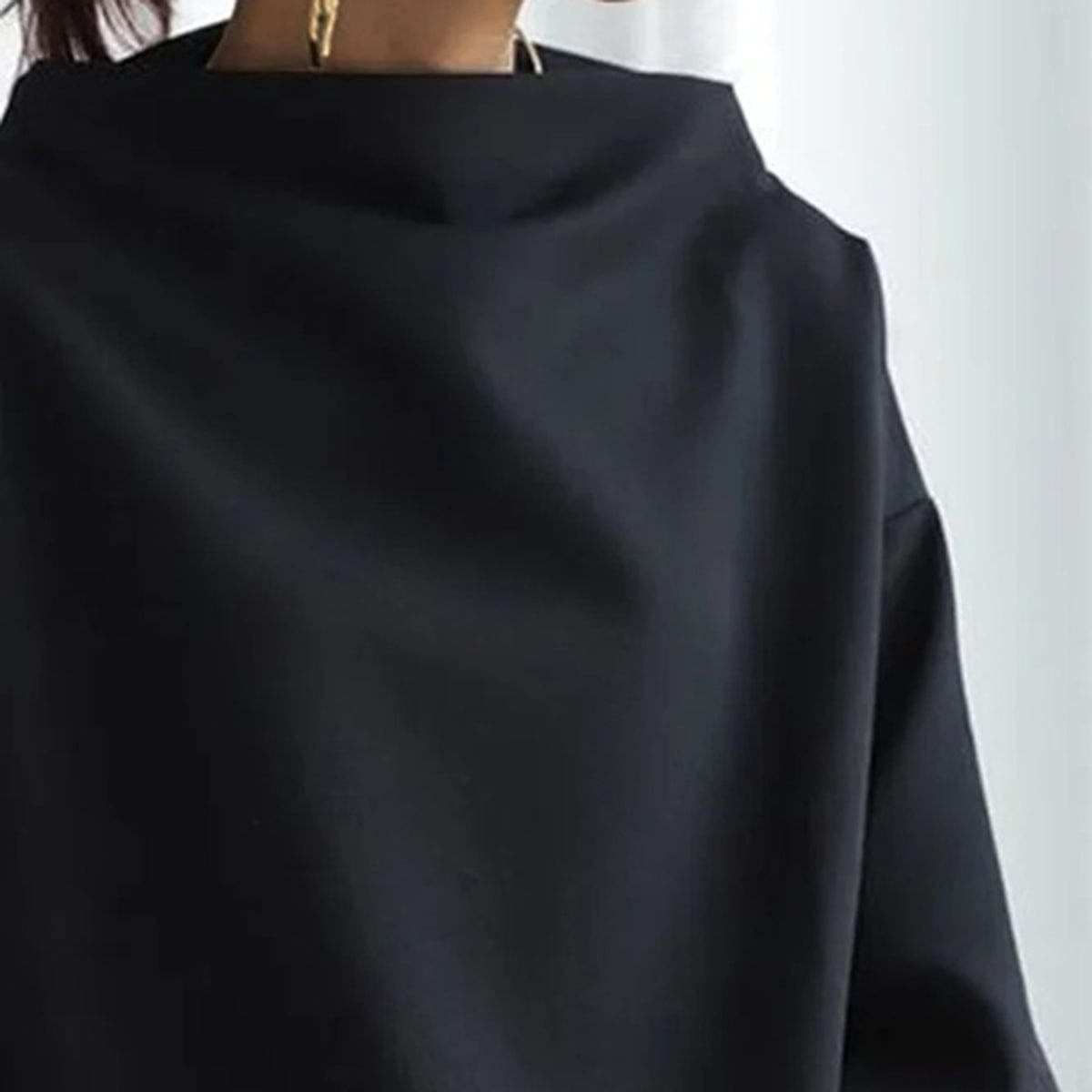 Christine Brewer Ivy high neck knit top for women, featuring a cozy, fitted design in soft fabric on a neutral background.