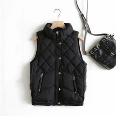 Women’s Ruby stand collar puffer vest by Christine Brewer, featuring a stylish quilted design and vibrant red color.
